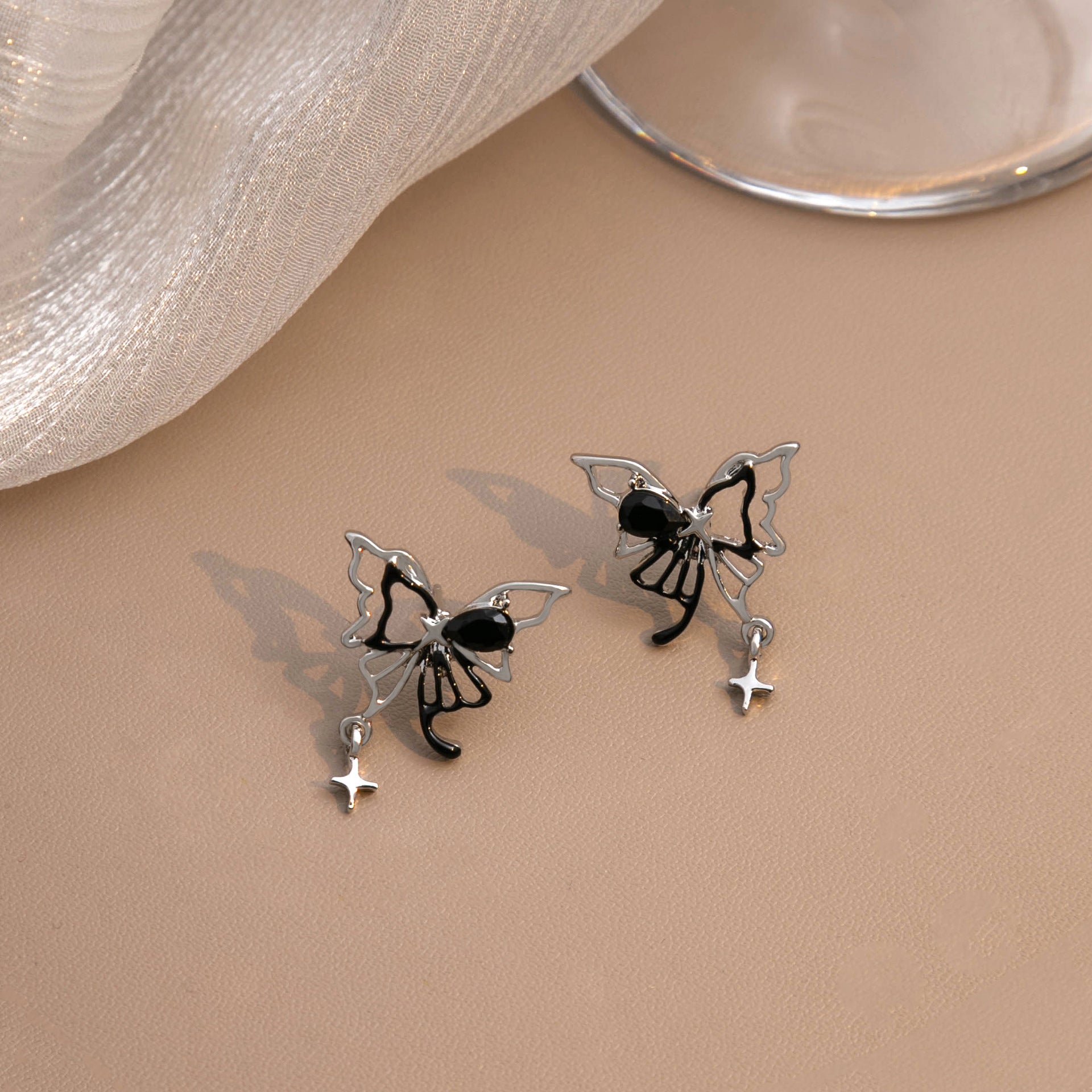 Wholesale Liquid Butterfly Hollow Alloy Earrings